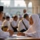 Calon jemaah berdiskusi mengenai persiapan ibadah haji di tengah polemik pemblokiran sebagian dana uang muka Haji 2027 oleh Arab Saudi.