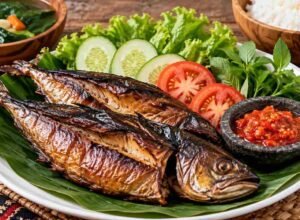 Ikan asap matang yang disajikan bersama sayuran sebagai ilustrasi cara aman mengonsumsi ikan asap.